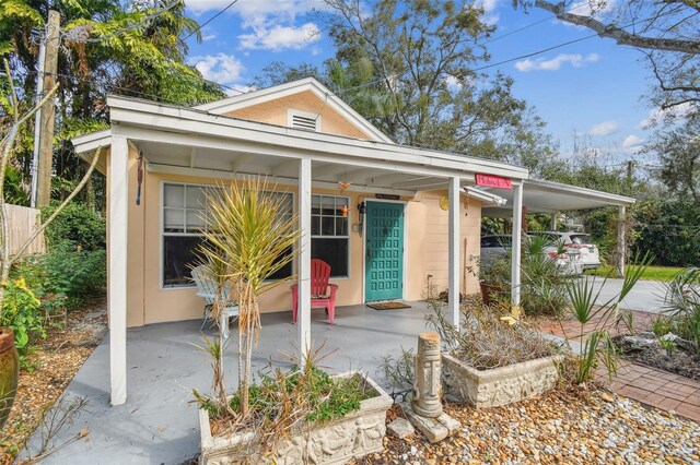 view of front of house with an attached carport