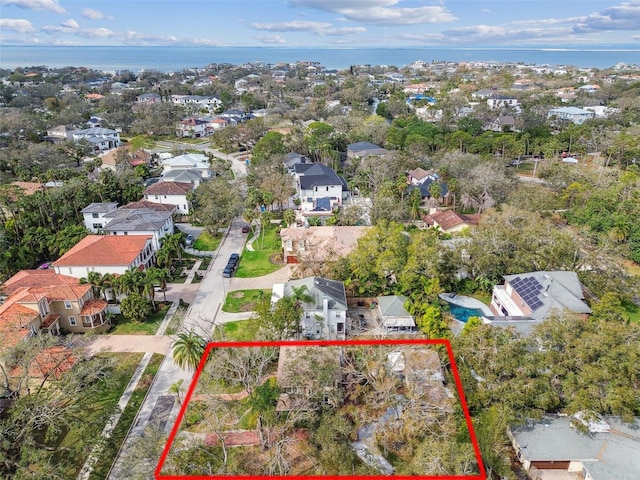 birds eye view of property featuring a water view and a residential view