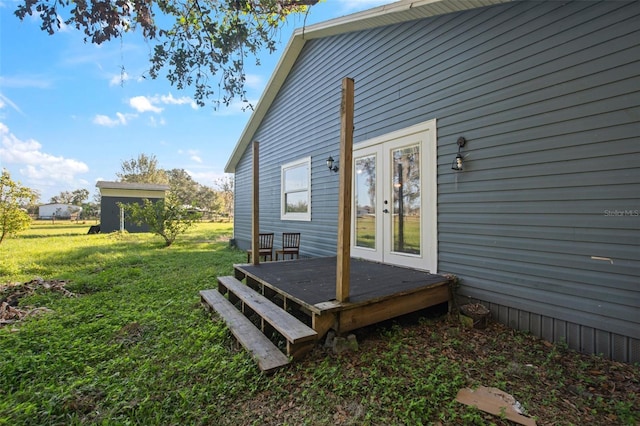 exterior space with a lawn and french doors