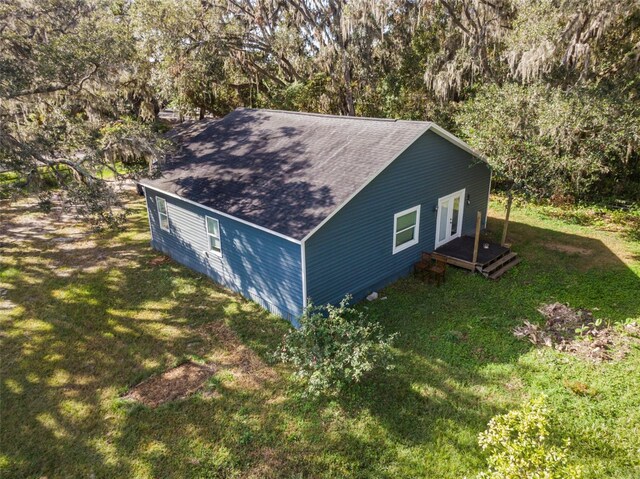 view of side of home featuring a yard