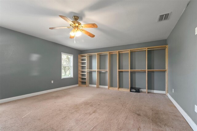 unfurnished bedroom featuring ceiling fan and carpet floors