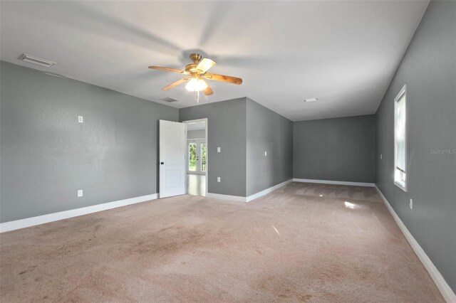 unfurnished room featuring carpet flooring and ceiling fan