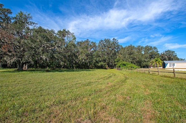 view of yard with a rural view