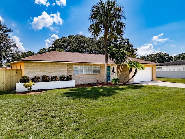 ranch-style home with a garage and a front lawn