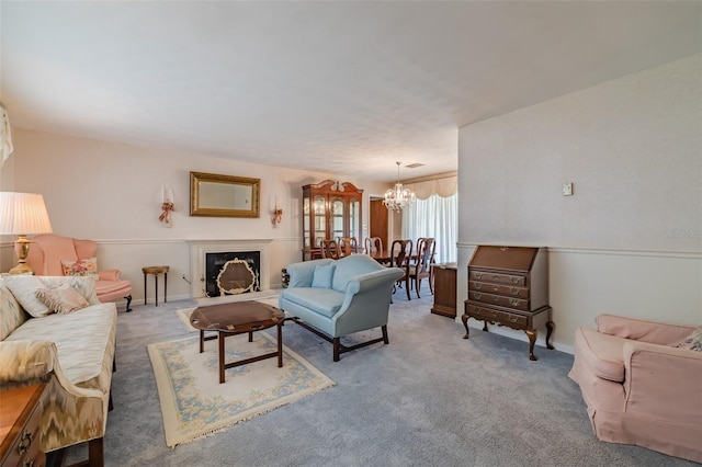 carpeted living room featuring a notable chandelier