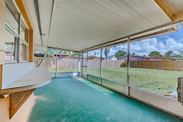 unfurnished sunroom with a wealth of natural light