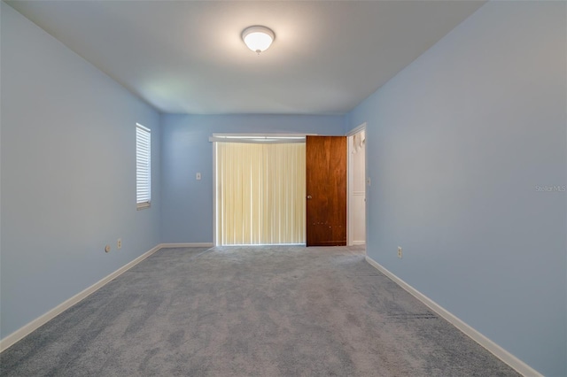 unfurnished bedroom with carpet flooring