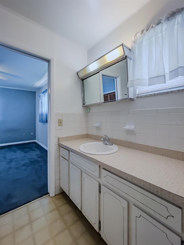 bathroom featuring vanity and ornamental molding