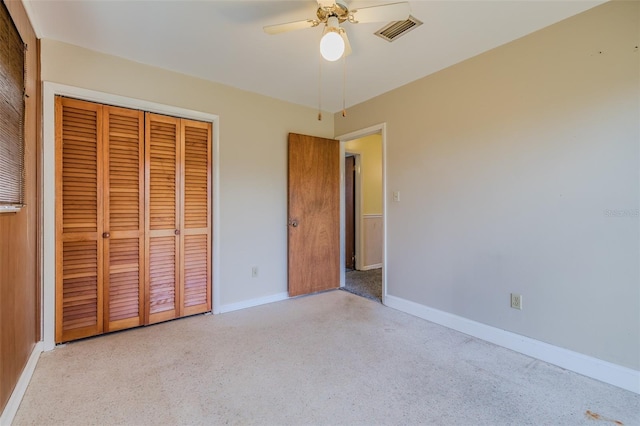 unfurnished bedroom featuring ceiling fan and a closet