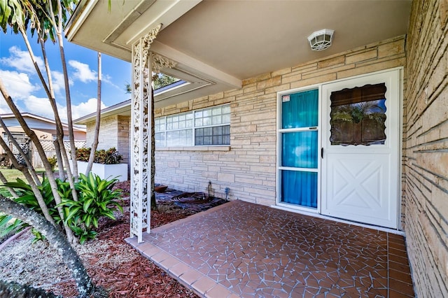 entrance to property featuring a patio area