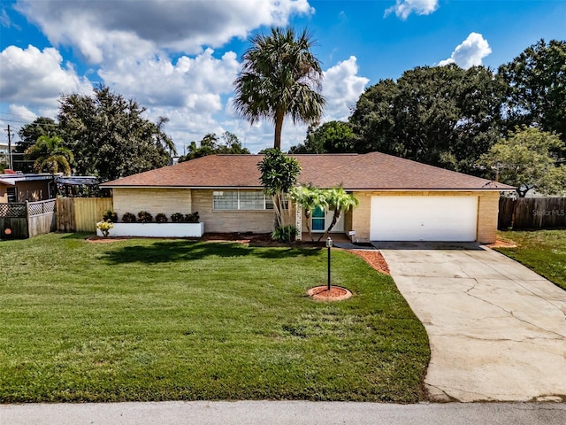 single story home featuring a front yard and a garage