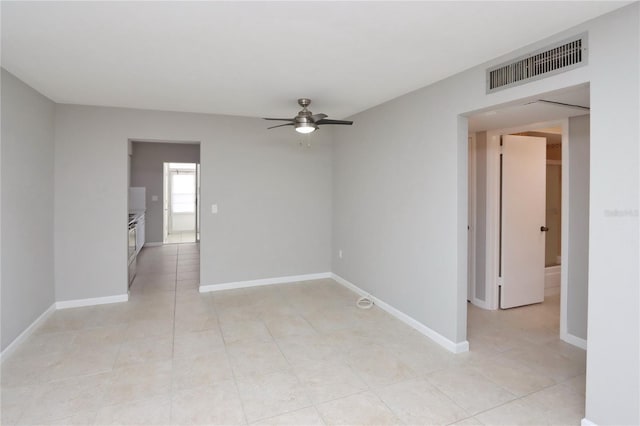 unfurnished room with ceiling fan and light tile patterned flooring