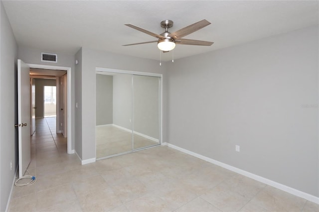 unfurnished bedroom featuring a textured ceiling, a closet, and ceiling fan