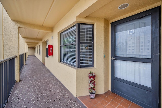 doorway to property with stucco siding