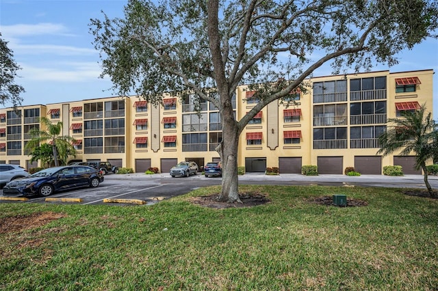 view of property featuring uncovered parking