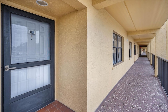 entrance to property featuring stucco siding