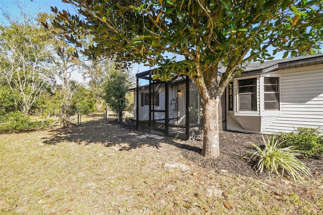 view of yard featuring a sunroom