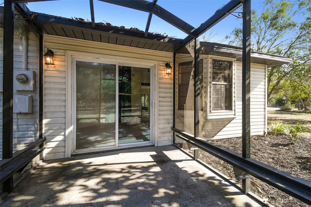 unfurnished sunroom featuring lofted ceiling