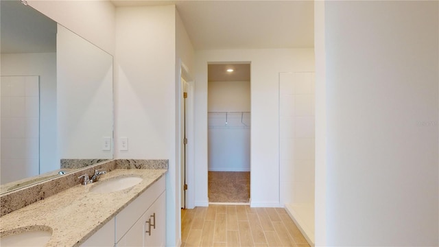 bathroom with hardwood / wood-style floors and vanity