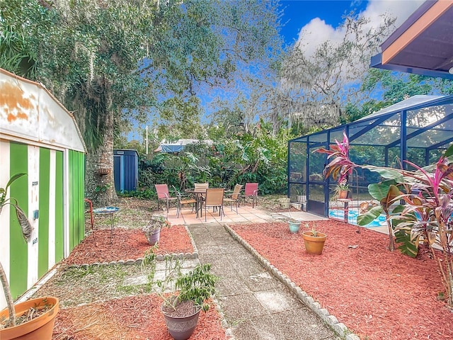 view of patio with a pool and a lanai