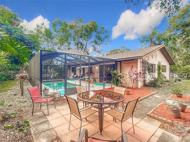 view of patio / terrace featuring a lanai