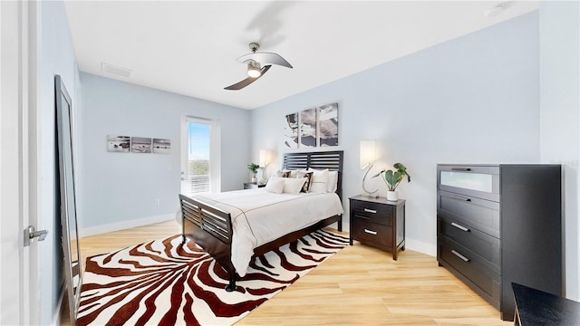 bedroom with light wood-type flooring, visible vents, ceiling fan, and baseboards