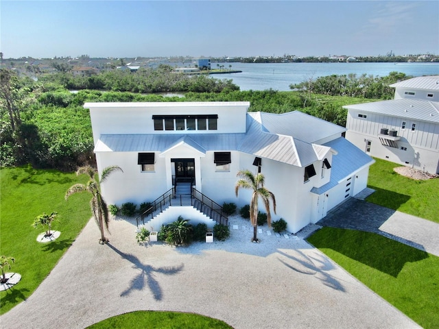 birds eye view of property featuring a water view