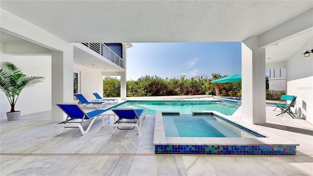 10101 Eagle Preserve Dr, Englewood, FL 34224 - view of pool featuring a pool with connected hot tub and a patio area
