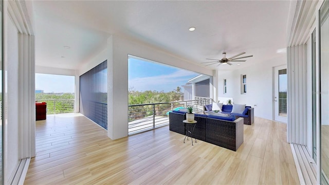 10101 Eagle Preserve Dr, Englewood, FL 34224 - living room with a ceiling fan and light wood-style flooring