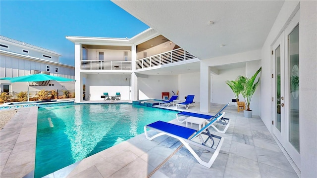 10101 Eagle Preserve Dr, Englewood, FL 34224 - view of pool with a pool with connected hot tub, a patio area, and french doors