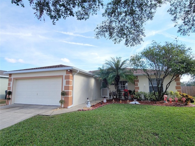 ranch-style home with a garage and a front lawn