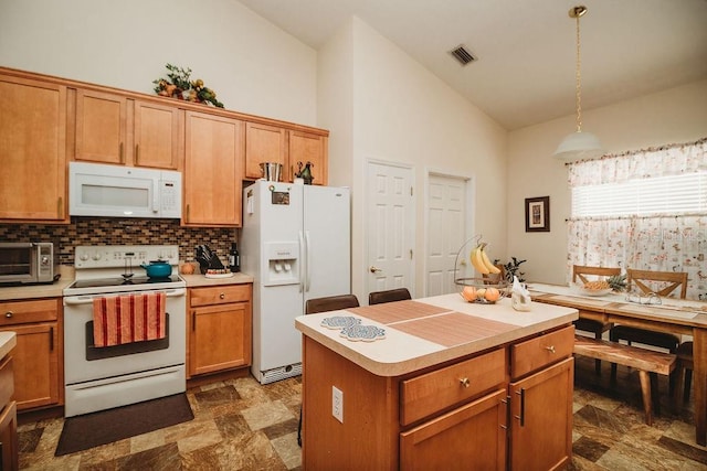 kitchen with backsplash, white appliances, high vaulted ceiling, a kitchen island, and hanging light fixtures