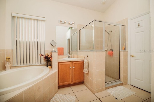 bathroom featuring tile patterned floors, vanity, and independent shower and bath