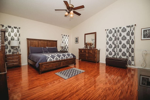 bedroom featuring wood-type flooring, vaulted ceiling, and ceiling fan