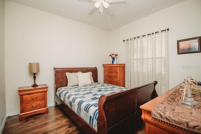 bedroom featuring ceiling fan and dark wood-type flooring