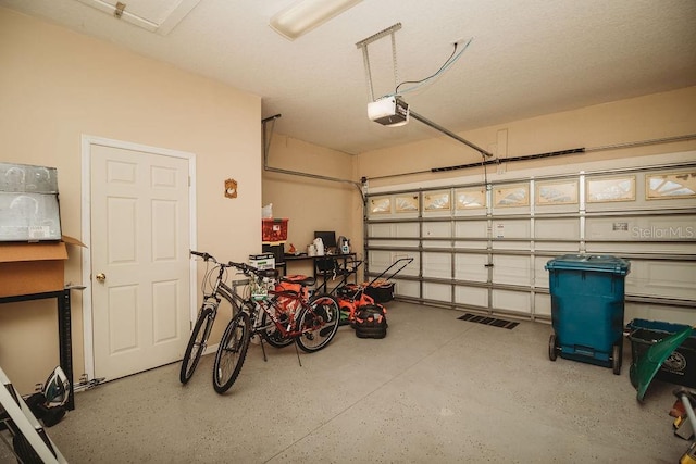 garage featuring a garage door opener