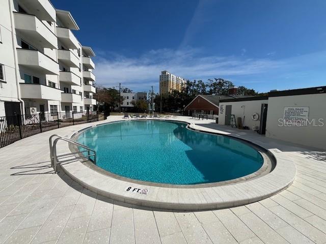 view of swimming pool with a patio area