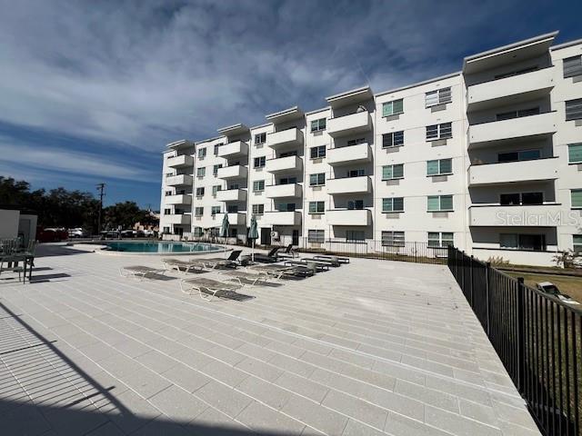 view of building exterior with a community pool