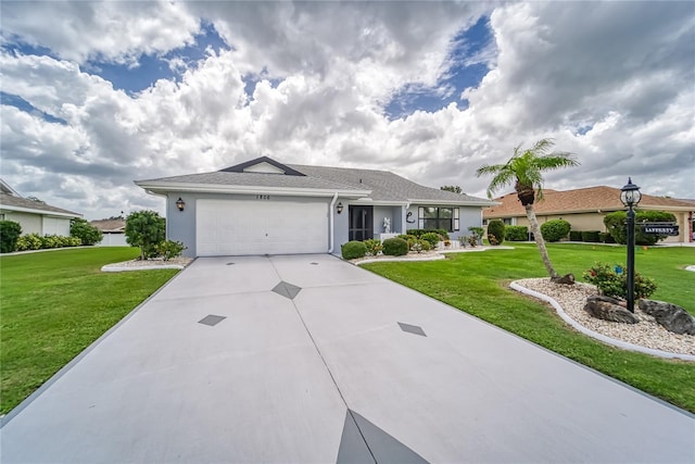 ranch-style house featuring a front lawn and a garage