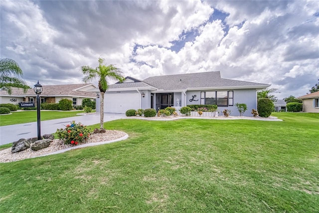 ranch-style house with a garage and a front lawn