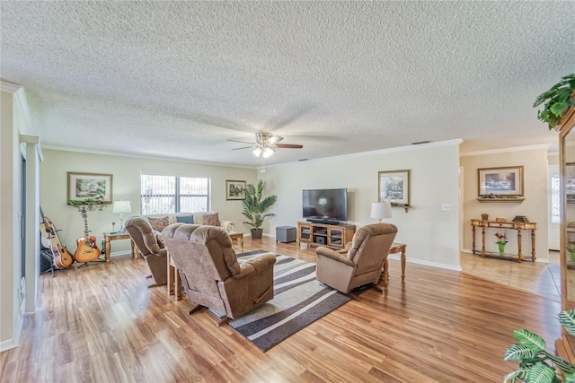 living room featuring a textured ceiling, light hardwood / wood-style floors, ceiling fan, and ornamental molding