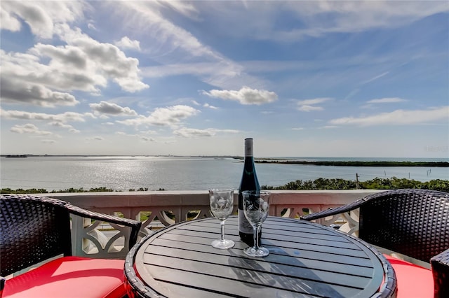 wooden deck featuring a water view