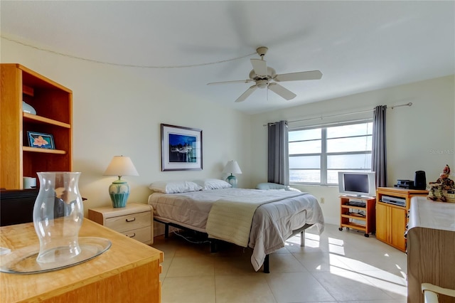 tiled bedroom with ceiling fan