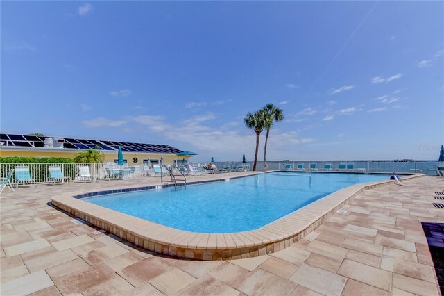 view of pool featuring a patio area