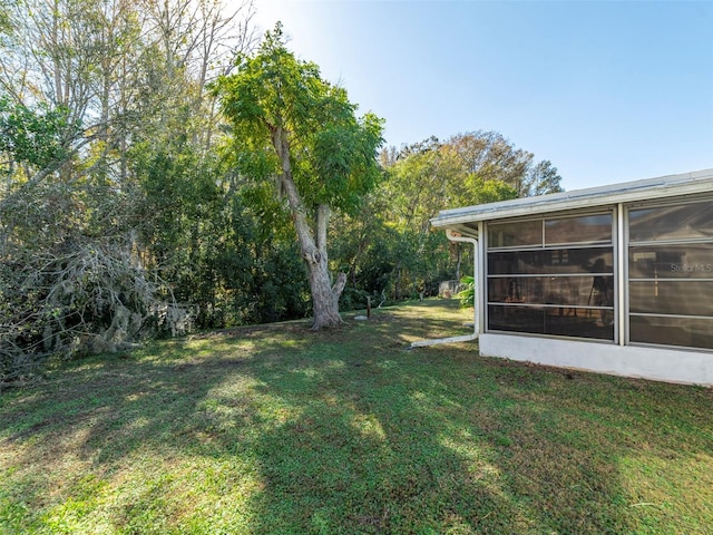 view of yard featuring a sunroom