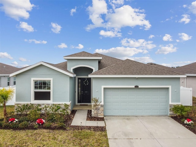 view of front of property with a garage