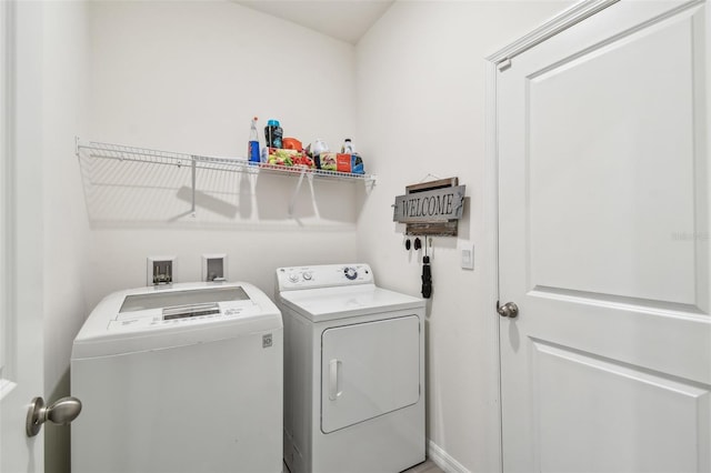 laundry room featuring separate washer and dryer