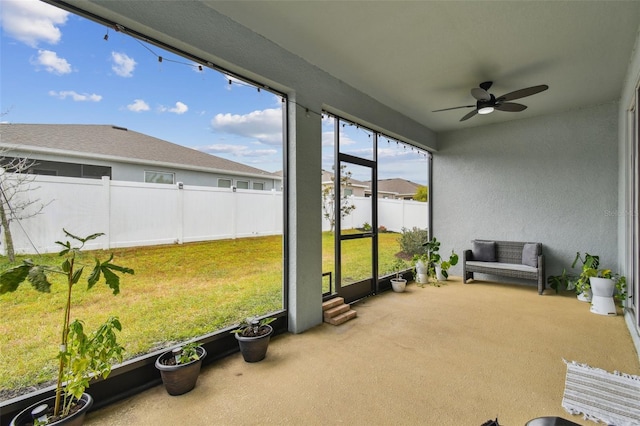 sunroom / solarium with ceiling fan