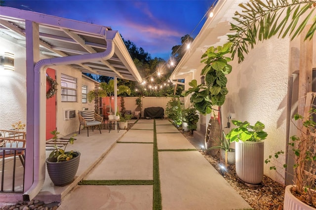 view of patio terrace at dusk