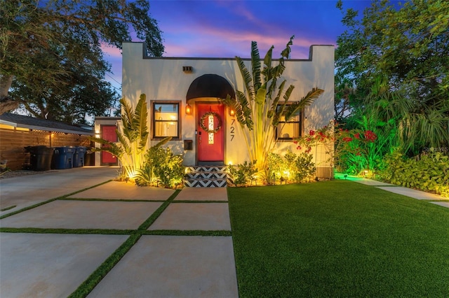 727 53rd Ter N, Saint Petersburg, FL 33703 - mediterranean / spanish home featuring a yard, driveway, and stucco siding